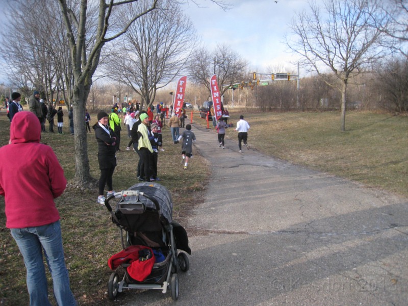 2013 Twinkie 5K 52.JPG - The 2013 Twinkie 5K. This is run on April Fools Day (April 1) every year. It is run in Ann Arbors Gallup Park. This year was a very cold and windy evening. (It is run at 6:15 pm)
